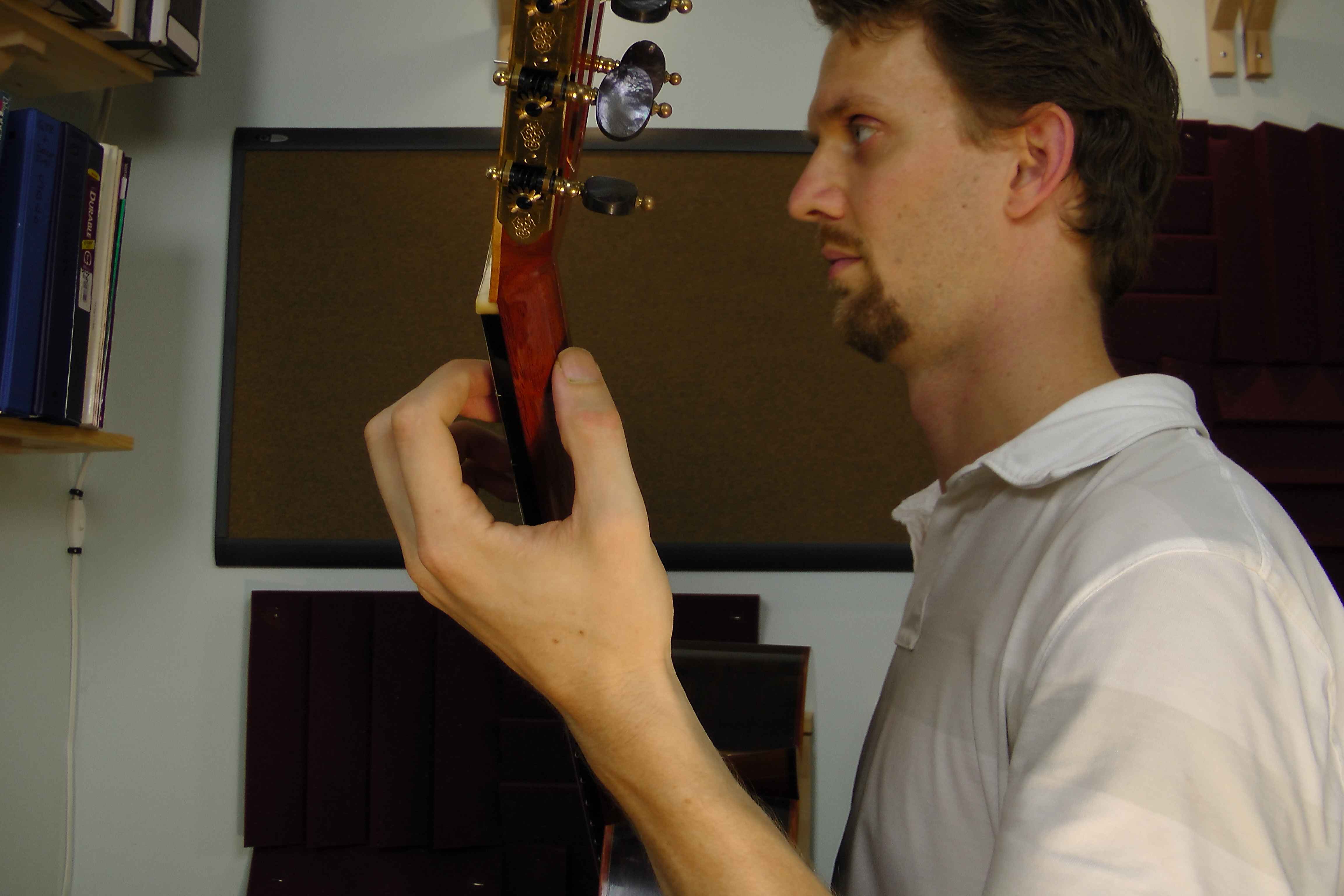 Left wrist aligned on the guitar