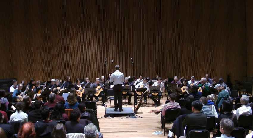 Sage conducts the New York City Guitar Orchestra Performing Mist
